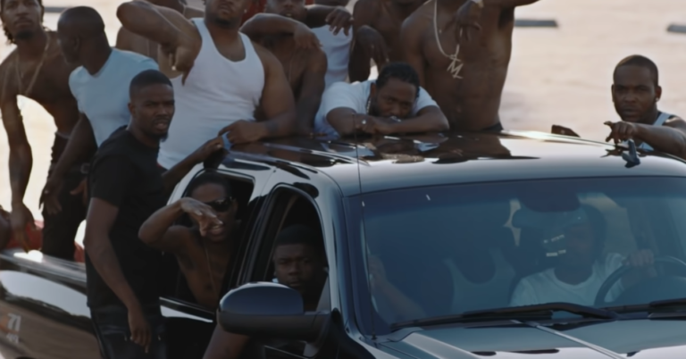 Kendrick Lamar in car in music video for 