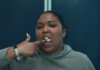Lizzo licking finger in "About Damn Time" music video