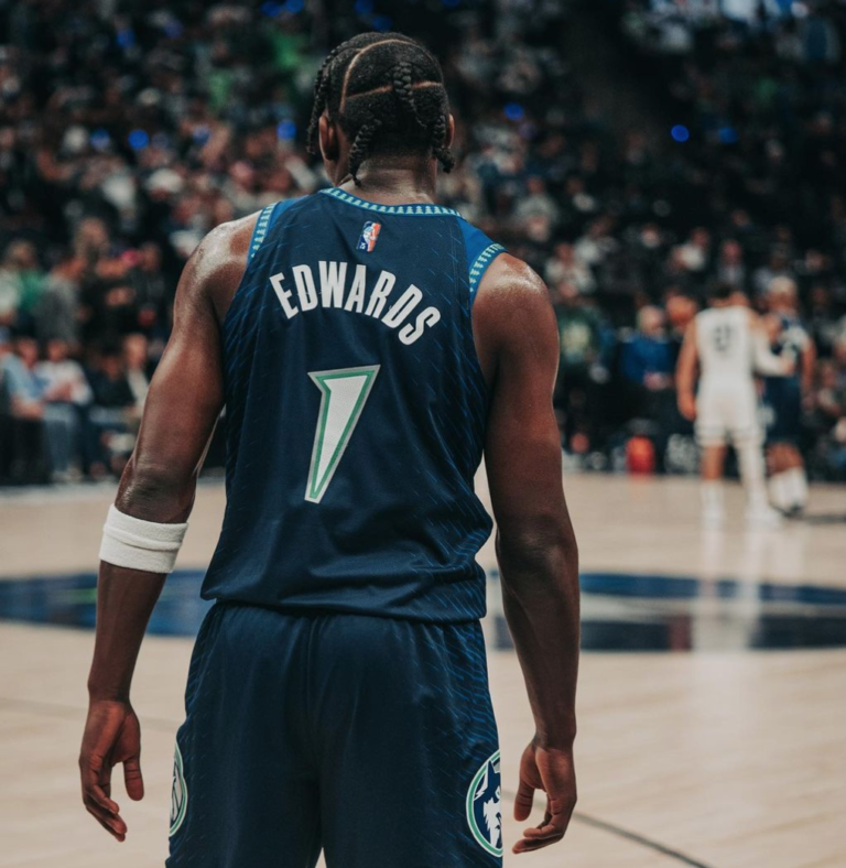 Picture of Minnesota Timberwolves guard Anthony Edwards from behind, capturing his jersey number and name as he looks down the court